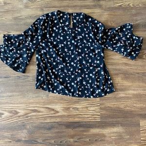 Black blouse with pink and white floral detail